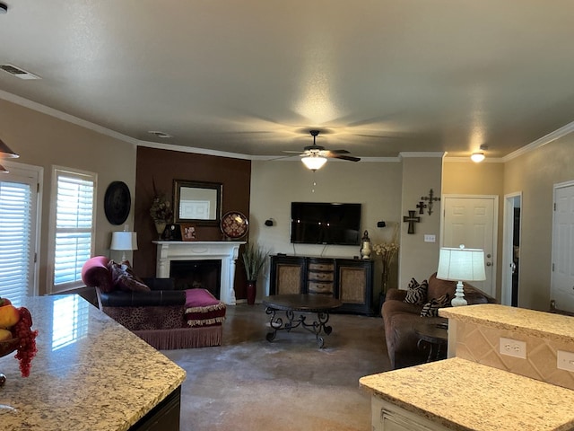 living room with carpet, ceiling fan, and crown molding