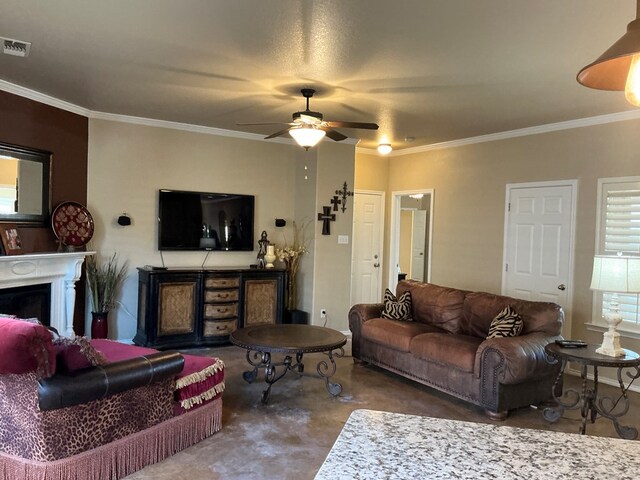 living room with ceiling fan and ornamental molding