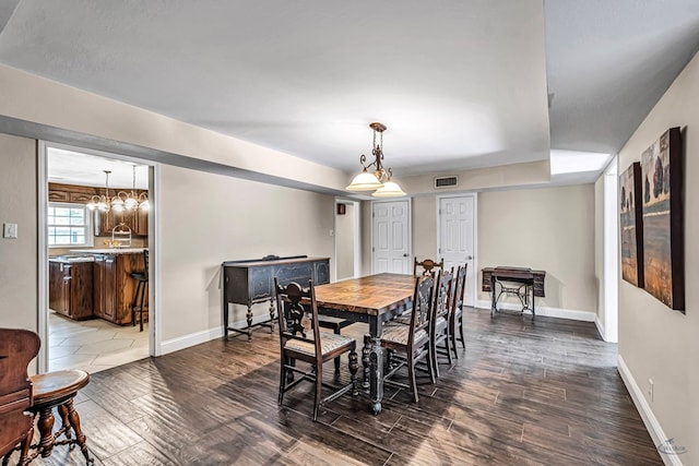 2611 Fannin Ave, Midland, TX 79705 - dining space with dark wood-type flooring, visible vents, and baseboards