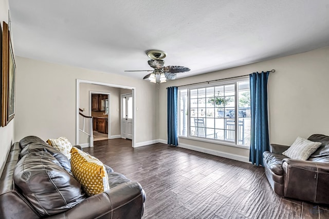 2611 Fannin Ave, Midland, TX 79705 - living room featuring baseboards, a ceiling fan, and dark wood-type flooring