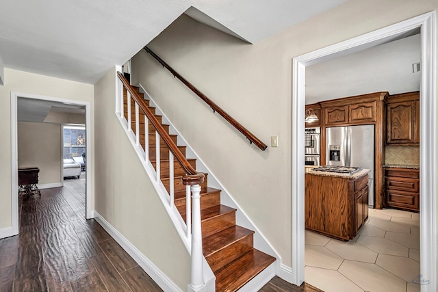2611 Fannin Ave, Midland, TX 79705 - stairway with wood finished floors and baseboards