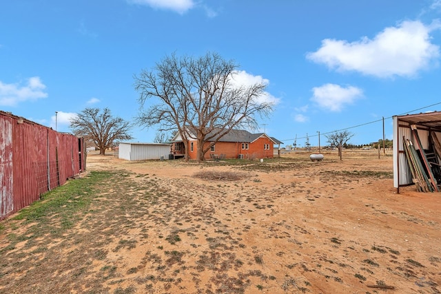 view of yard with a rural view