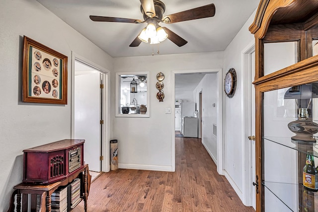 hall with wood-type flooring