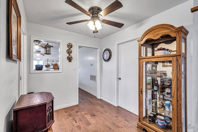 corridor featuring hardwood / wood-style flooring