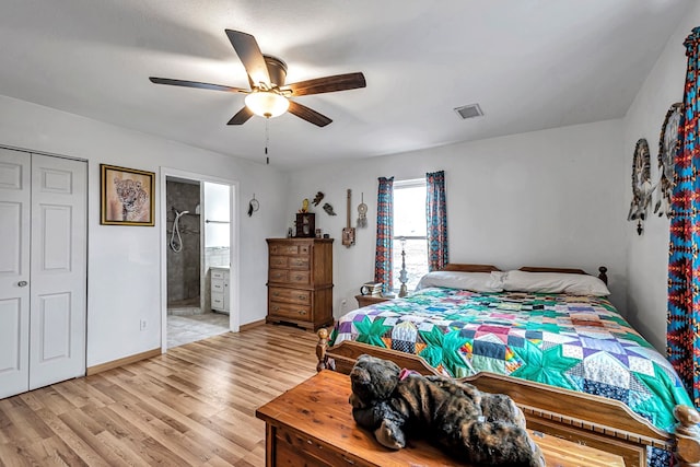 bedroom with ensuite bathroom, ceiling fan, light hardwood / wood-style floors, and a closet