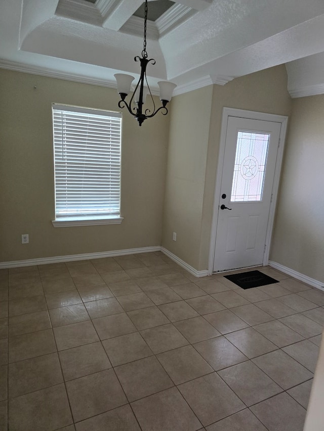 foyer entrance featuring an inviting chandelier, light tile patterned flooring, and ornamental molding