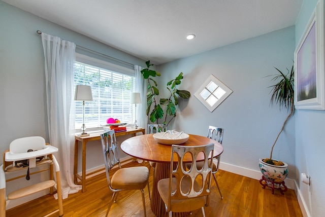 dining area featuring hardwood / wood-style flooring