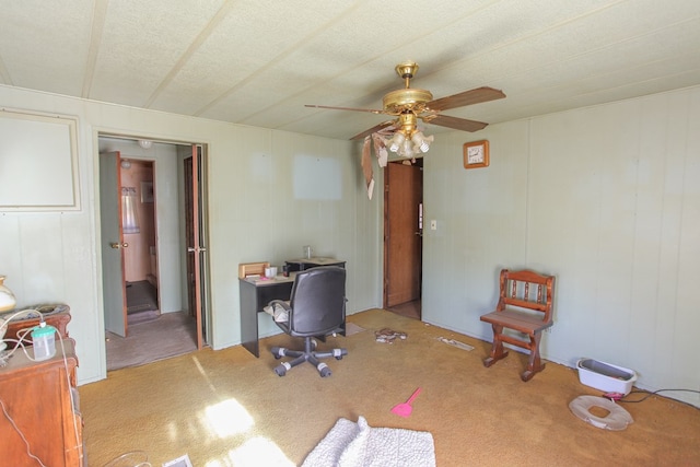 home office with a ceiling fan and light colored carpet