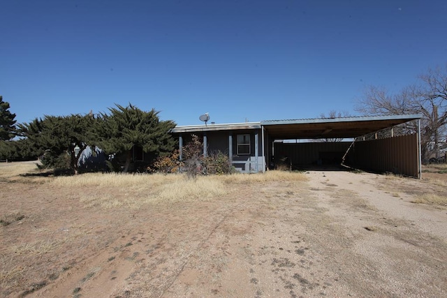 view of front facade featuring driveway and an attached carport