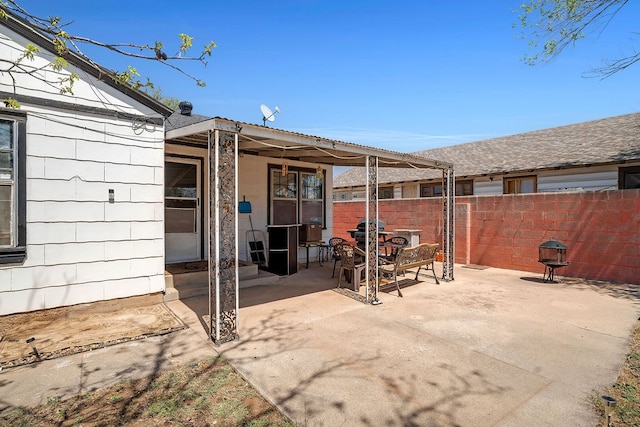 view of patio with fence and outdoor dining area