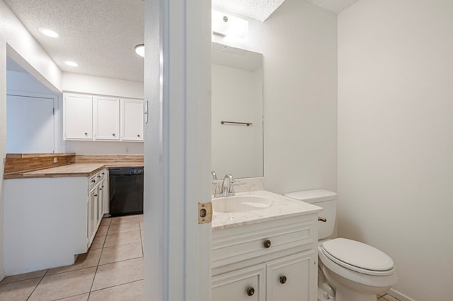 bathroom featuring a textured ceiling, tile patterned flooring, toilet, recessed lighting, and vanity