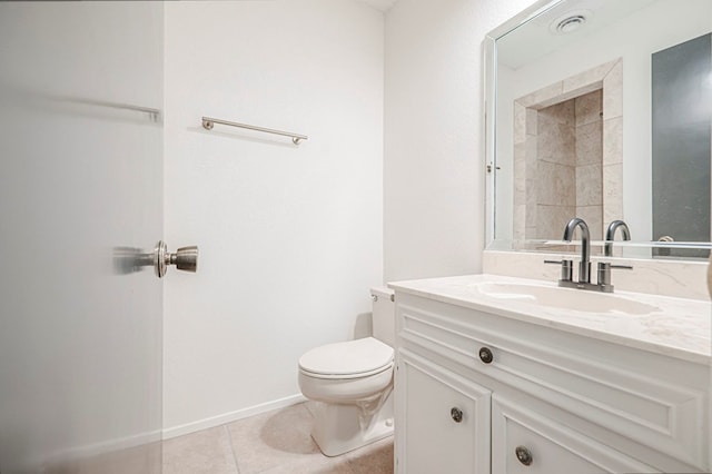 full bathroom with toilet, vanity, baseboards, and tile patterned floors