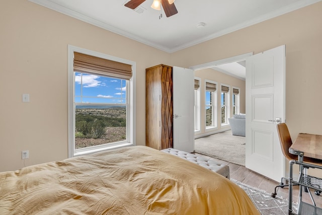 131 High Lonesome Dr, Alpine, TX 79830 - bedroom with ornamental molding, wood finished floors, and a ceiling fan