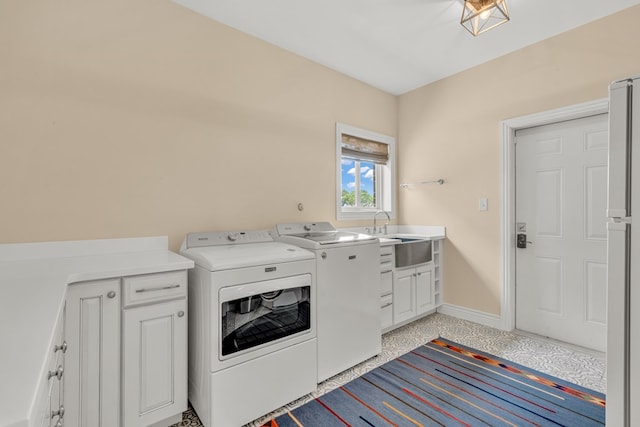 131 High Lonesome Dr, Alpine, TX 79830 - washroom featuring washer and clothes dryer, cabinet space, and baseboards