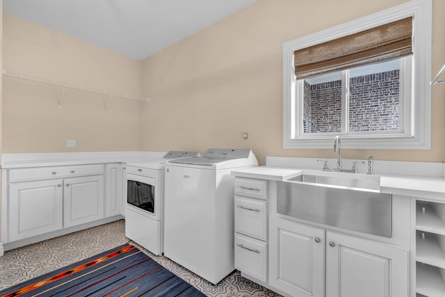 131 High Lonesome Dr, Alpine, TX 79830 - laundry area featuring washer and dryer and cabinet space