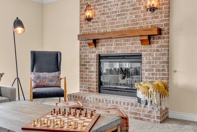 131 High Lonesome Dr, Alpine, TX 79830 - living area featuring carpet floors, baseboards, a brick fireplace, and crown molding