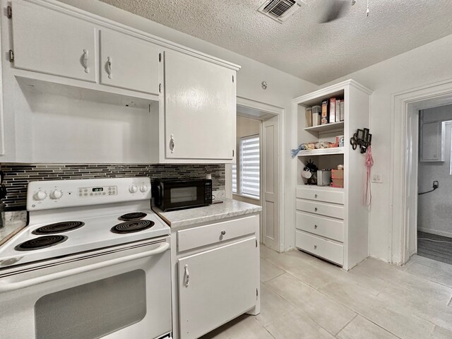 kitchen with white cabinets, tasteful backsplash, white electric stove, and a textured ceiling