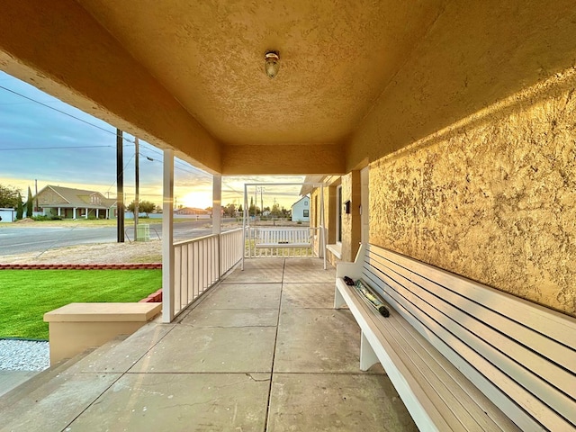 patio terrace at dusk with a porch