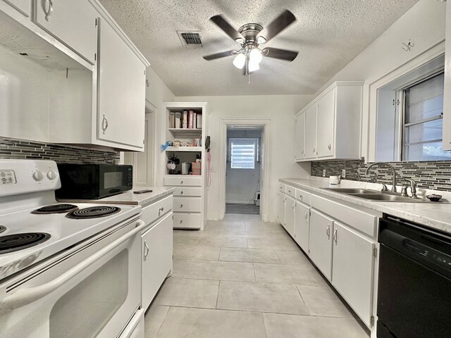 kitchen with backsplash, white cabinetry, sink, and black appliances