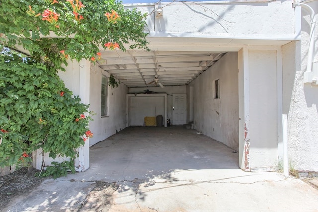 view of vehicle parking with a carport