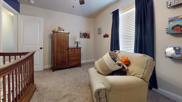 carpeted bedroom featuring a ceiling fan and baseboards