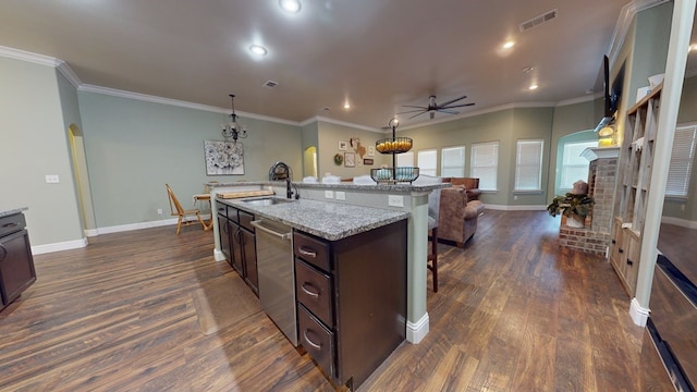 kitchen featuring arched walkways, open floor plan, a kitchen island with sink, dark brown cabinets, and dishwasher