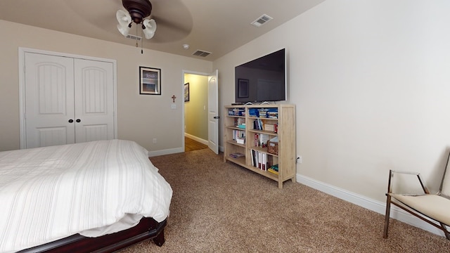 carpeted bedroom with ceiling fan, a closet, visible vents, and baseboards