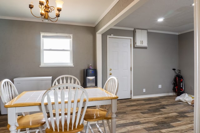 dining area with a notable chandelier, ornamental molding, dark wood-style flooring, and baseboards