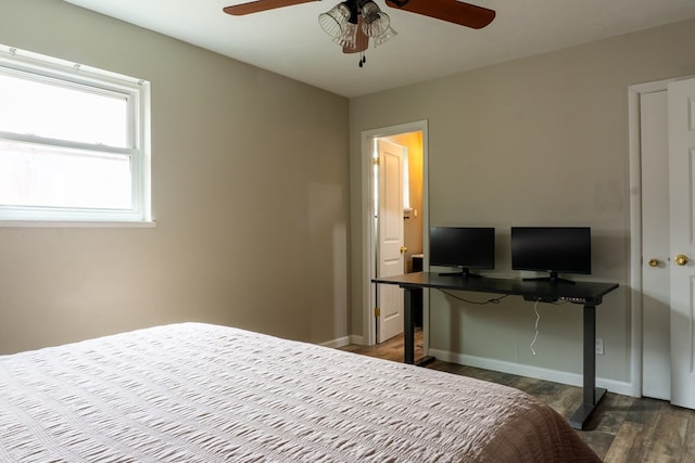 bedroom with ceiling fan, wood finished floors, and baseboards