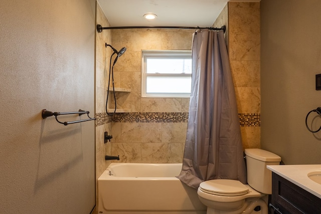 bathroom featuring vanity, shower / bath combo with shower curtain, and toilet