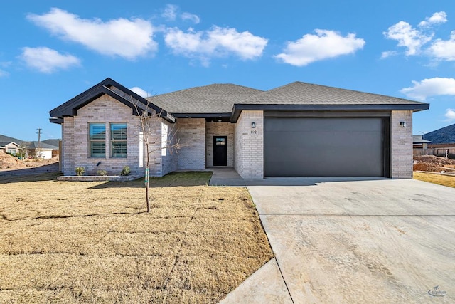 view of front of house with a front lawn and a garage