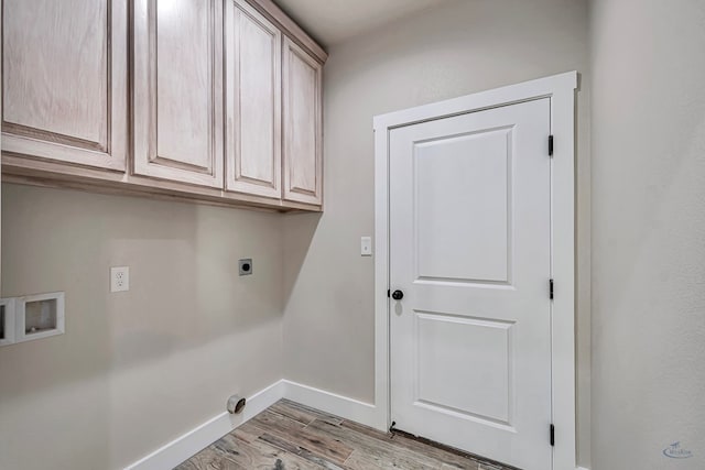 laundry area with cabinets, hookup for a washing machine, light wood-type flooring, and hookup for an electric dryer