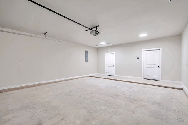 garage featuring electric panel and a garage door opener