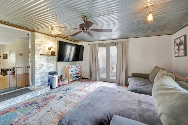 living area featuring french doors and ceiling fan