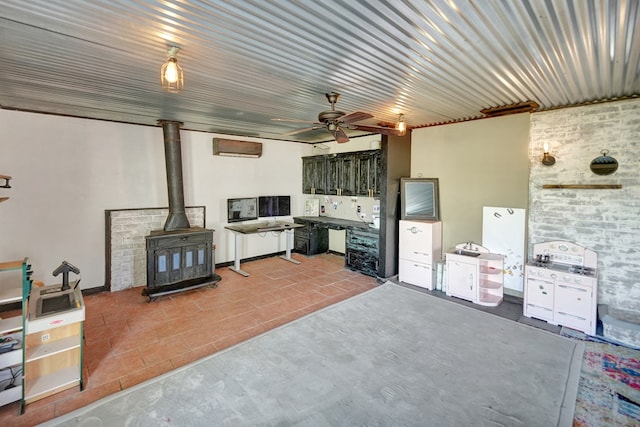 view of patio / terrace featuring exterior kitchen and a ceiling fan