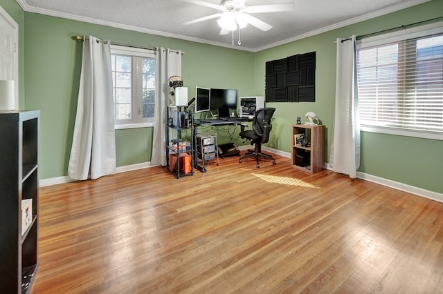 office with baseboards, ornamental molding, ceiling fan, and wood finished floors