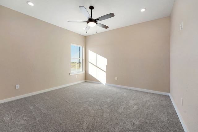 empty room with carpet flooring and ceiling fan