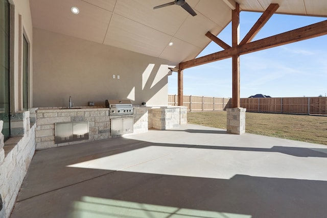 view of patio featuring area for grilling, ceiling fan, and sink