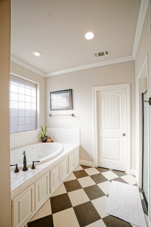 bathroom featuring ornamental molding, visible vents, a jetted tub, and tile patterned floors