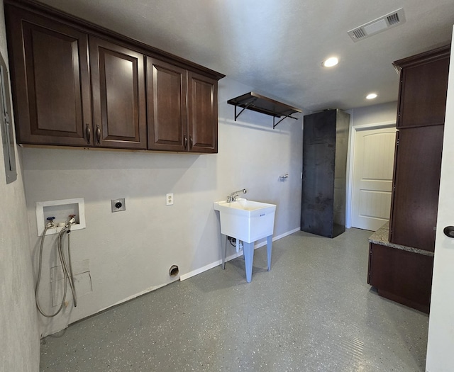 clothes washing area featuring hookup for a washing machine, baseboards, visible vents, cabinet space, and electric dryer hookup