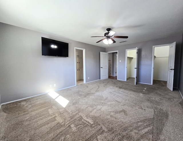 unfurnished bedroom with visible vents, baseboards, ceiling fan, and carpet flooring