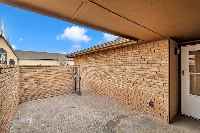 view of patio featuring fence