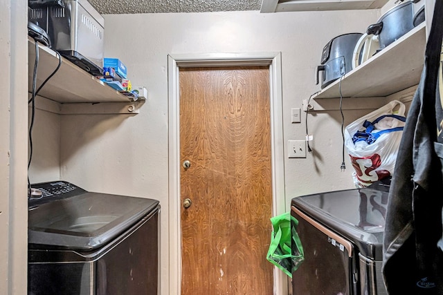 laundry area with laundry area and washer and clothes dryer