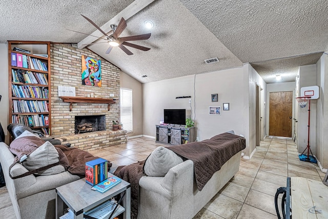 living area featuring visible vents, lofted ceiling with beams, a textured ceiling, light tile patterned floors, and a brick fireplace