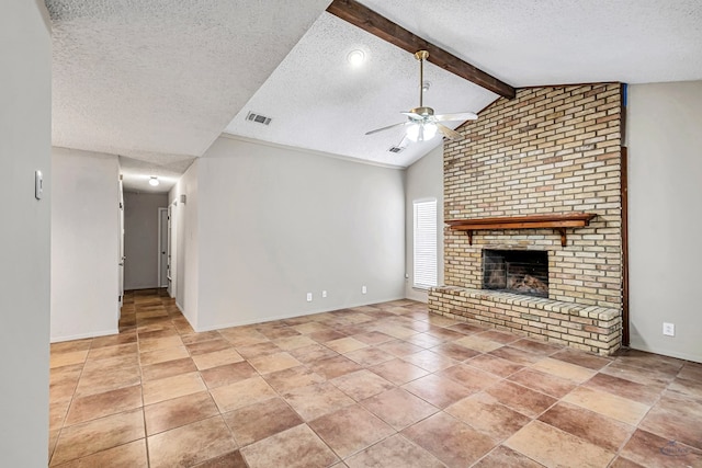 unfurnished living room featuring visible vents, lofted ceiling with beams, a textured ceiling, a fireplace, and ceiling fan