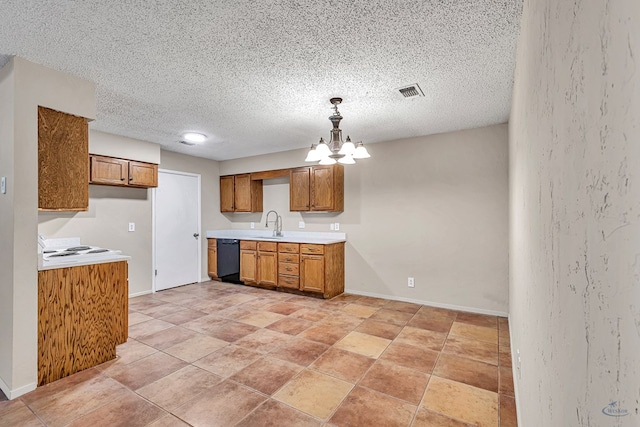 kitchen with dishwasher, a notable chandelier, visible vents, and brown cabinets