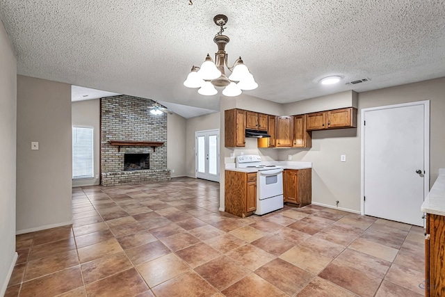 kitchen with visible vents, brown cabinets, electric stove, open floor plan, and light countertops