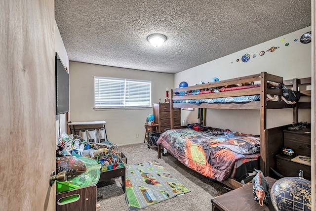 carpeted bedroom with a textured ceiling and baseboards