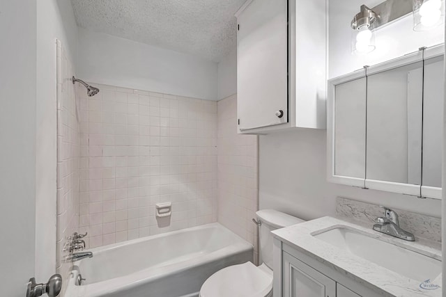 full bath featuring vanity, toilet, shower / bathtub combination, and a textured ceiling