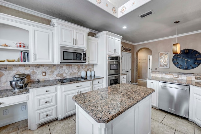 10104 E County Rd 103, Midland, TX 79706 - kitchen featuring stainless steel appliances, arched walkways, decorative backsplash, white cabinetry, and ornamental molding